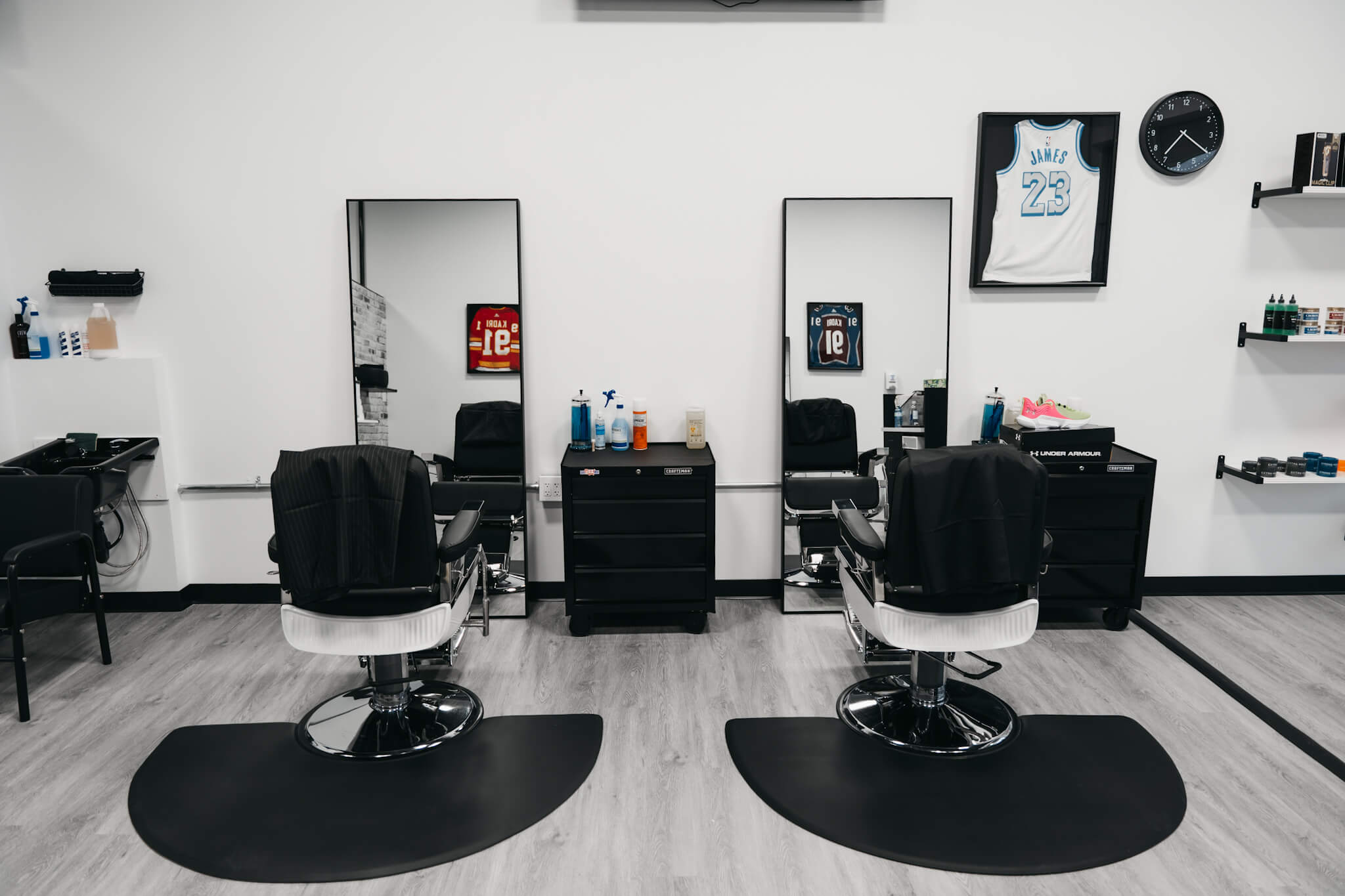 Macleod Trail Barbers Barbershop and Chairs styled in black and white with a clean, crisp, and modern aesthetic.